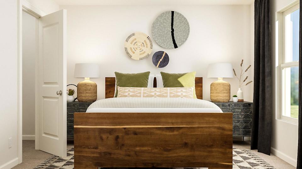 A bed with green pillows.