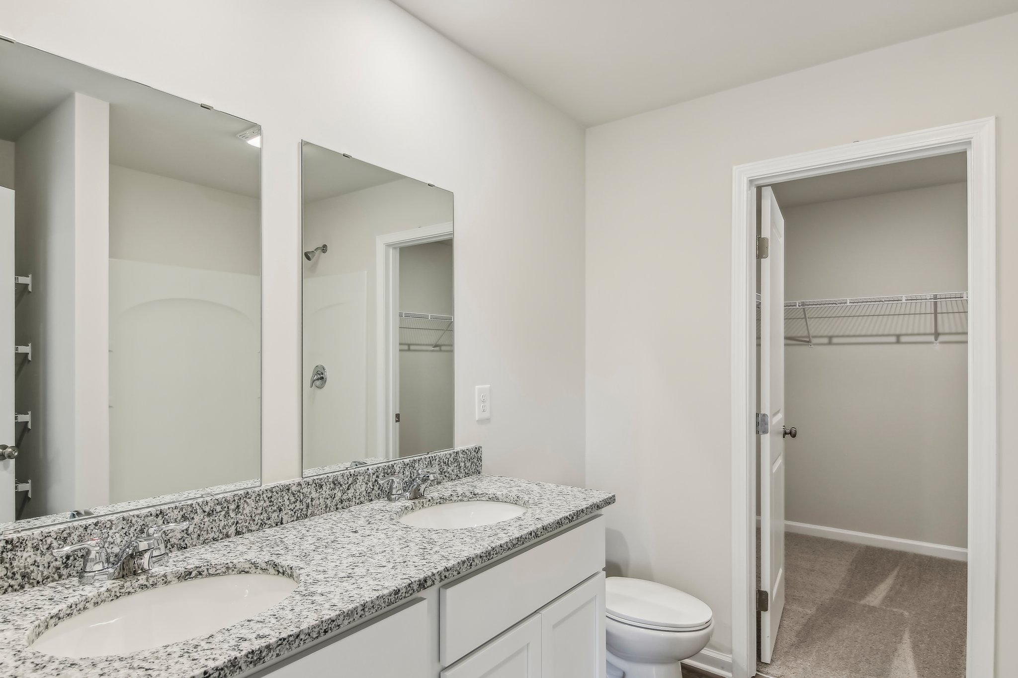 A bathroom with a marble countertop.