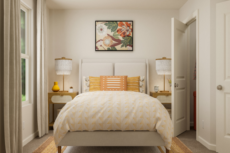 A bedroom with a bed and lamps.