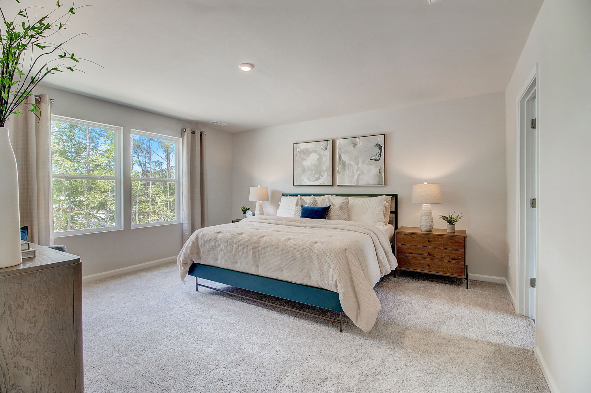 A bedroom with a large bed.