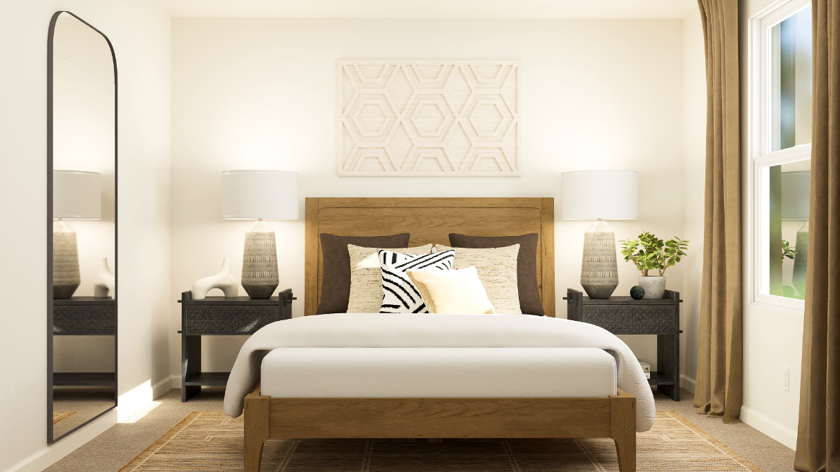 A bed with lamps on either side.